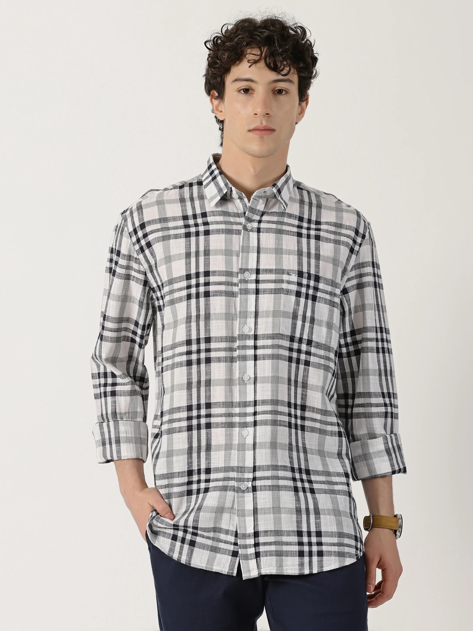 white shirt featuring a combination of black and green check lines